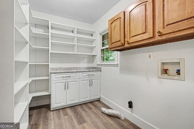 This charming split-level home with a rocking chair front porch - photo 13
