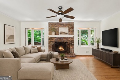 This charming split-level home with a rocking chair front porch - photo 14