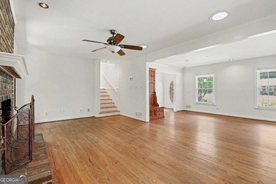 This charming split-level home with a rocking chair front porch - photo 17