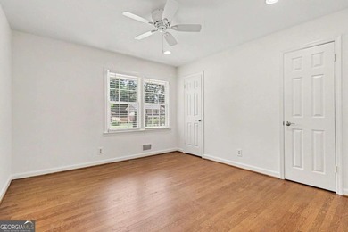 This charming split-level home with a rocking chair front porch - photo 18
