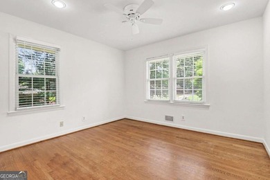 This charming split-level home with a rocking chair front porch - photo 19