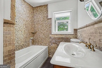This charming split-level home with a rocking chair front porch - photo 20