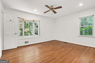 This charming split-level home with a rocking chair front porch - photo 21