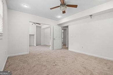This charming split-level home with a rocking chair front porch - photo 26
