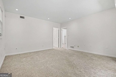 This charming split-level home with a rocking chair front porch - photo 29