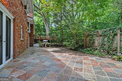 This charming split-level home with a rocking chair front porch - photo 31