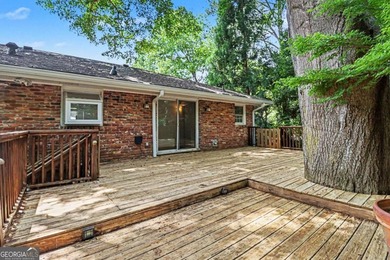This charming split-level home with a rocking chair front porch - photo 32