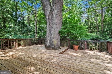 This charming split-level home with a rocking chair front porch - photo 33