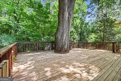 This charming split-level home with a rocking chair front porch - photo 34