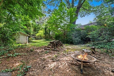 This charming split-level home with a rocking chair front porch - photo 35