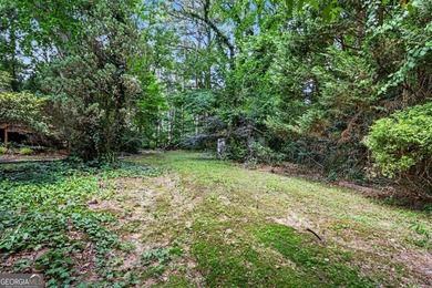 This charming split-level home with a rocking chair front porch - photo 36