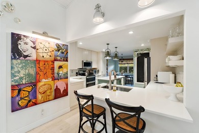 Nestled on an oversized, beautifully landscaped lot in the - photo 17