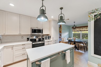 Nestled on an oversized, beautifully landscaped lot in the - photo 19