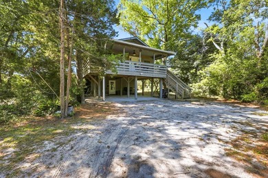 Tucked beneath a canopy of mature trees just minutes from the - photo 2