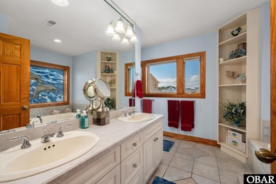 This oceanfront home offers panoramic water views and direct