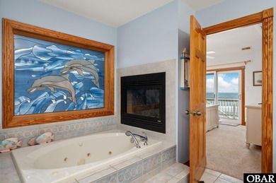 This oceanfront home offers panoramic water views and direct