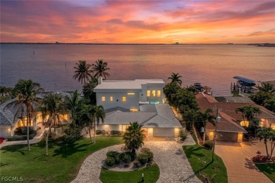 Discover this unique and elegant 2-story waterfront mansion in - photo 2