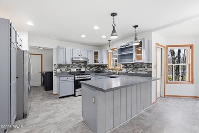 This beautifully maintained home sits on a 1-acre wooded - photo 11