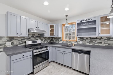 This beautifully maintained home sits on a 1-acre wooded - photo 13