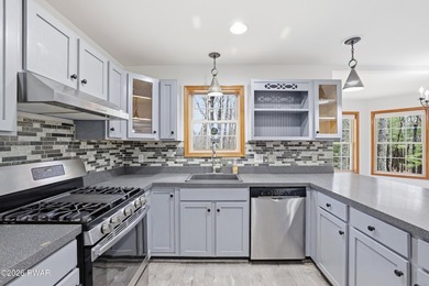 This beautifully maintained home sits on a 1-acre wooded - photo 14