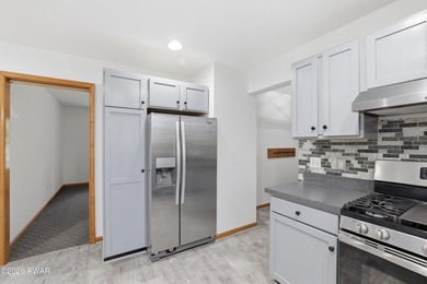 This beautifully maintained home sits on a 1-acre wooded - photo 15