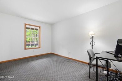 This beautifully maintained home sits on a 1-acre wooded - photo 16