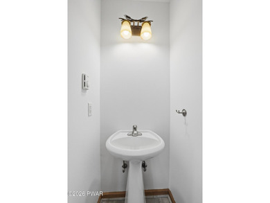 This beautifully maintained home sits on a 1-acre wooded - photo 17