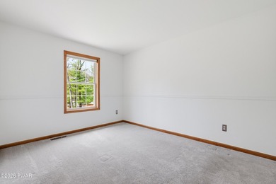 This beautifully maintained home sits on a 1-acre wooded - photo 19