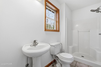 This beautifully maintained home sits on a 1-acre wooded - photo 32