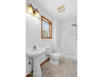 This beautifully maintained home sits on a 1-acre wooded - photo 33