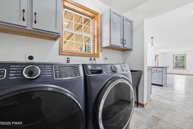 This beautifully maintained home sits on a 1-acre wooded - photo 46