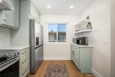 Impeccably remodeled top-floor condominium in a fantastic