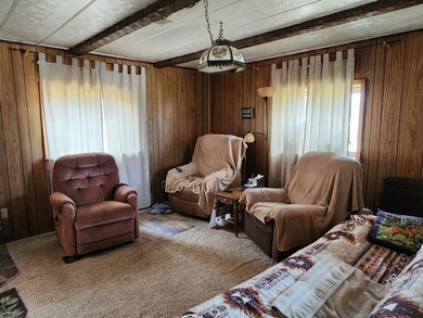 Casa Real 14x60 mobile home with added additions. Structure sits