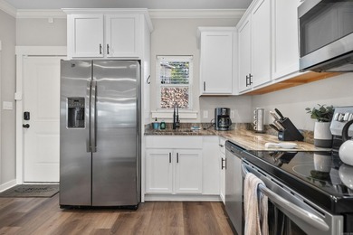 ~Turnkey. Waterfront. Income-ready.~ Built in 2020, this - photo 7