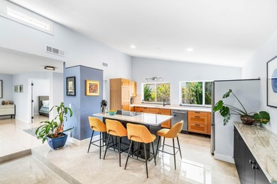 Beautiful golf course views surround this bright and inviting