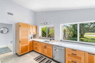 Beautiful golf course views surround this bright and inviting