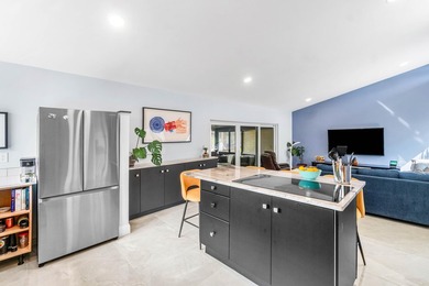 Beautiful golf course views surround this bright and inviting