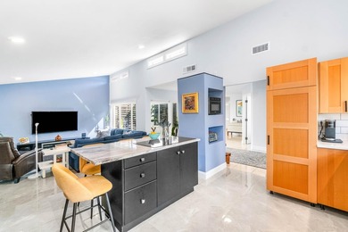 Beautiful golf course views surround this bright and inviting