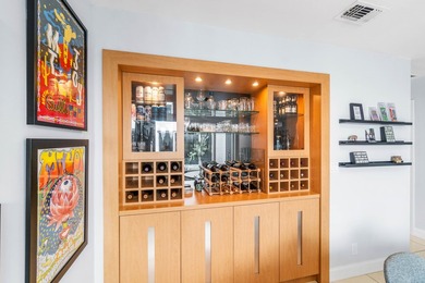 Beautiful golf course views surround this bright and inviting