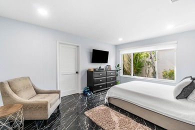 Beautiful golf course views surround this bright and inviting