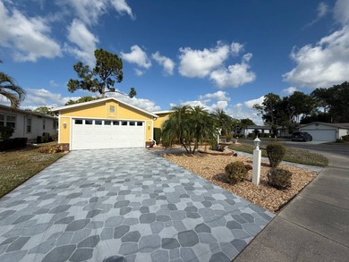 This well cared for 2-bedroom, 2-bathroom Palm Harbor home is - photo 2