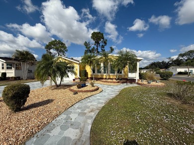 This well cared for 2-bedroom, 2-bathroom Palm Harbor home is - photo 3