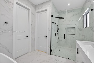 Built in 2023, this modern single-family residence offers the - photo 24