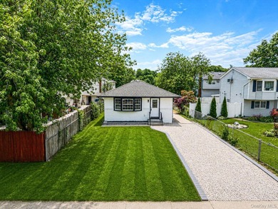 Welcome to 64 Cedar Drive, Bay Shore, NY 11706. This beautifully - photo 1