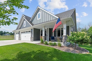 Luxury, low-maintenance living meets peaceful wooded privacy in - photo 1
