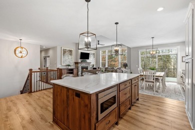 Luxury, low-maintenance living meets peaceful wooded privacy in - photo 5