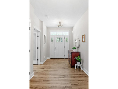 Luxury, low-maintenance living meets peaceful wooded privacy in - photo 7