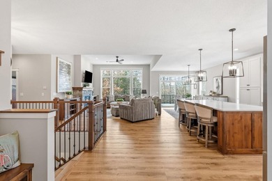 Luxury, low-maintenance living meets peaceful wooded privacy in - photo 10