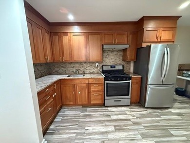 Well-maintained two-family brick home located in the highly - photo 15