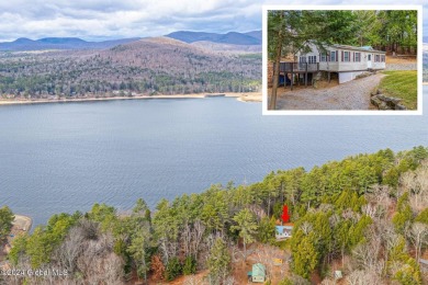 Discover lakeside charm and mountain views in this enchanting - Lake Home For Sale in Day, New York